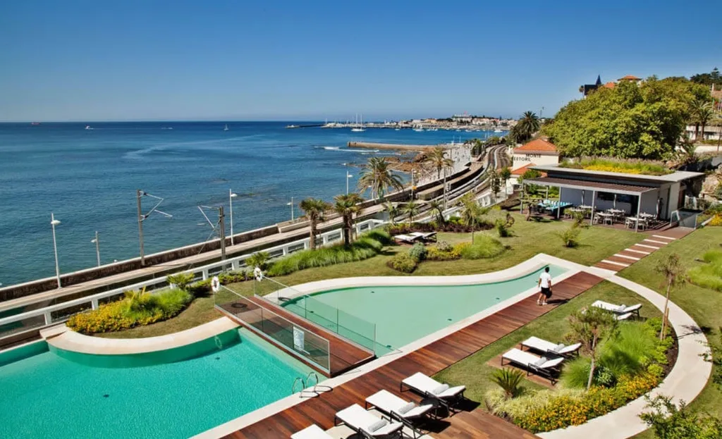 Outdoor pool overlooking the beach at Inter-Continental Cascais-Estoril