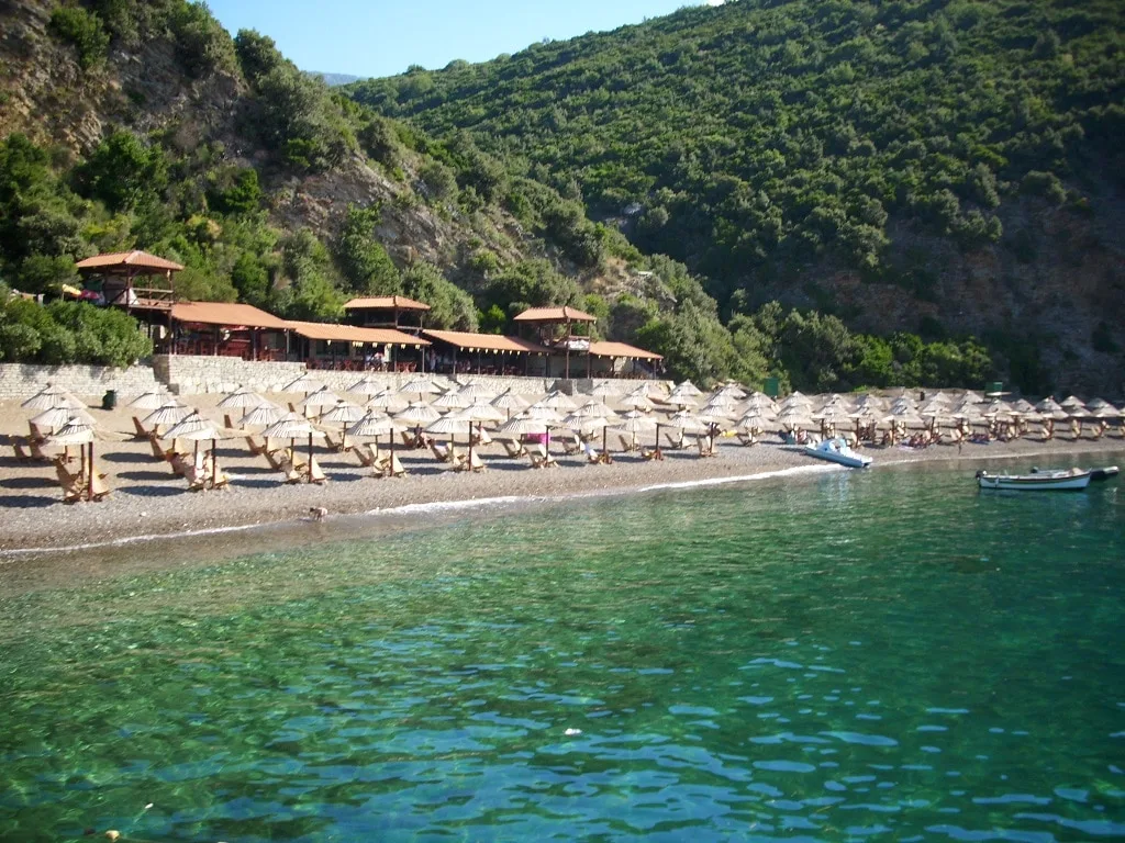 Queen's Beach Sunbeds and Pristine Water