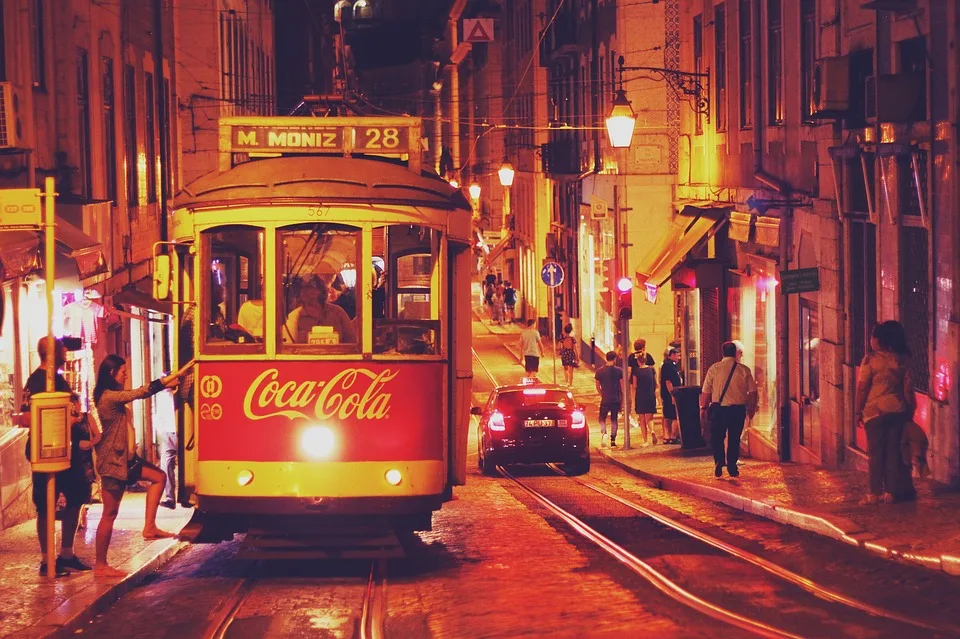 A bustling street in Lisbon at night