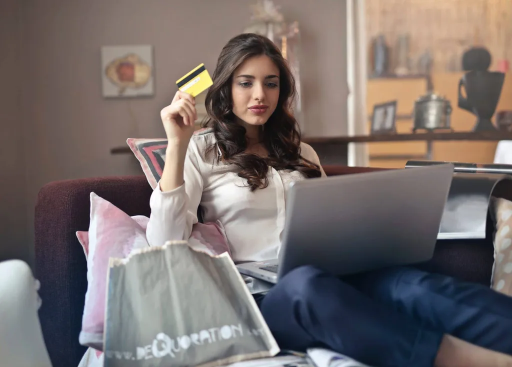 Women Shopping Online With Credit Card And Laptop