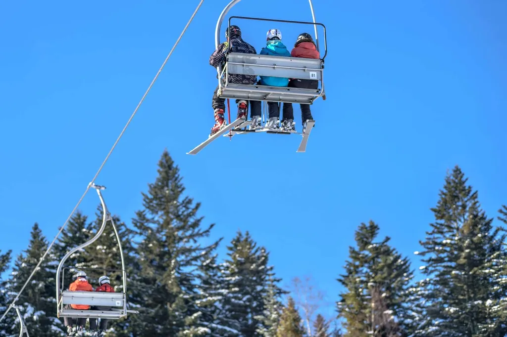 Family trip to ski resort in cable car