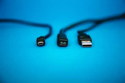 three different charging cables on a blue background