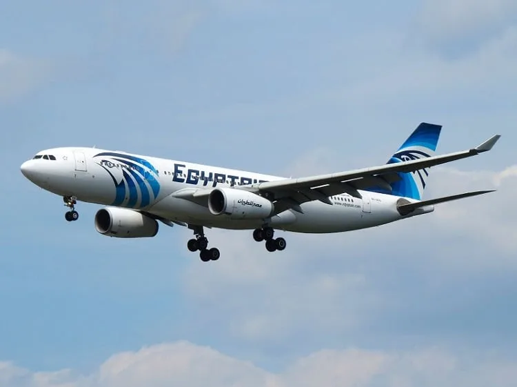 EgyptAir Plane Flying across Blue Sky