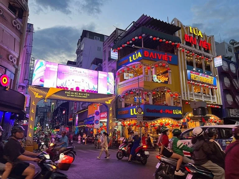 Bustling walking street with lamps all around. Photo credit: Somil Gupta