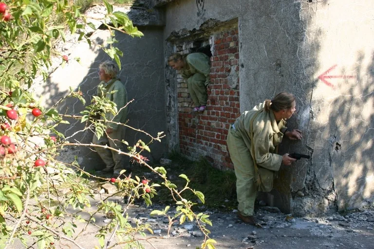 Visitors taking part in a spy game in Liepaja Jail Hotel