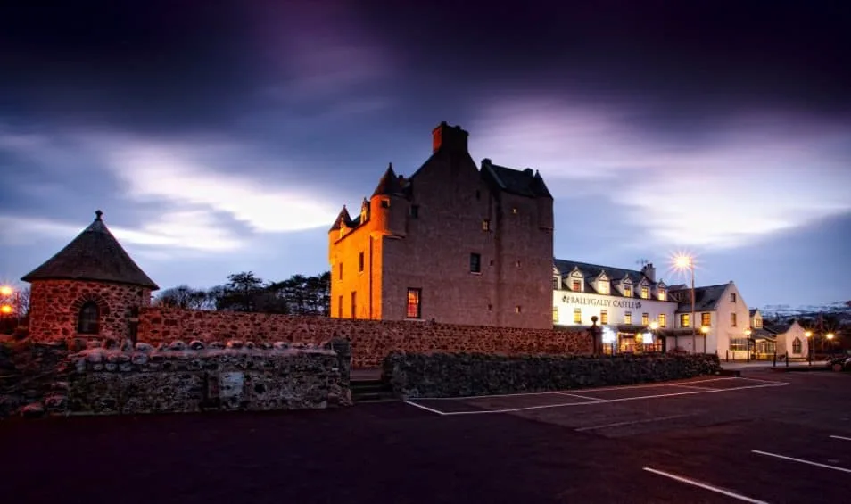 Ballygally Castle, one of the Most Haunted Hotels Around the World, at dusk