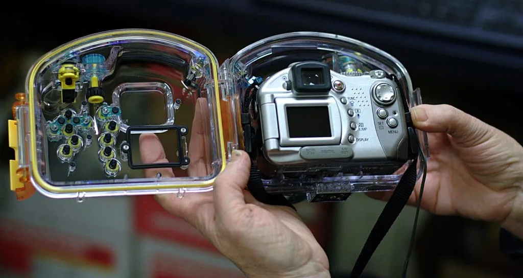 Don't forget to include a waterproof case in your travel photography kit to counter different weather condition and protect your camera
