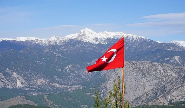 Turkish Flag wwith mountains in background